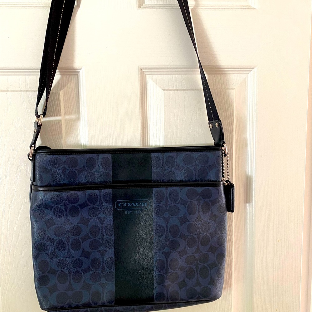 Black coach cross body bag with blue coach accent. Perfect for a man or woman